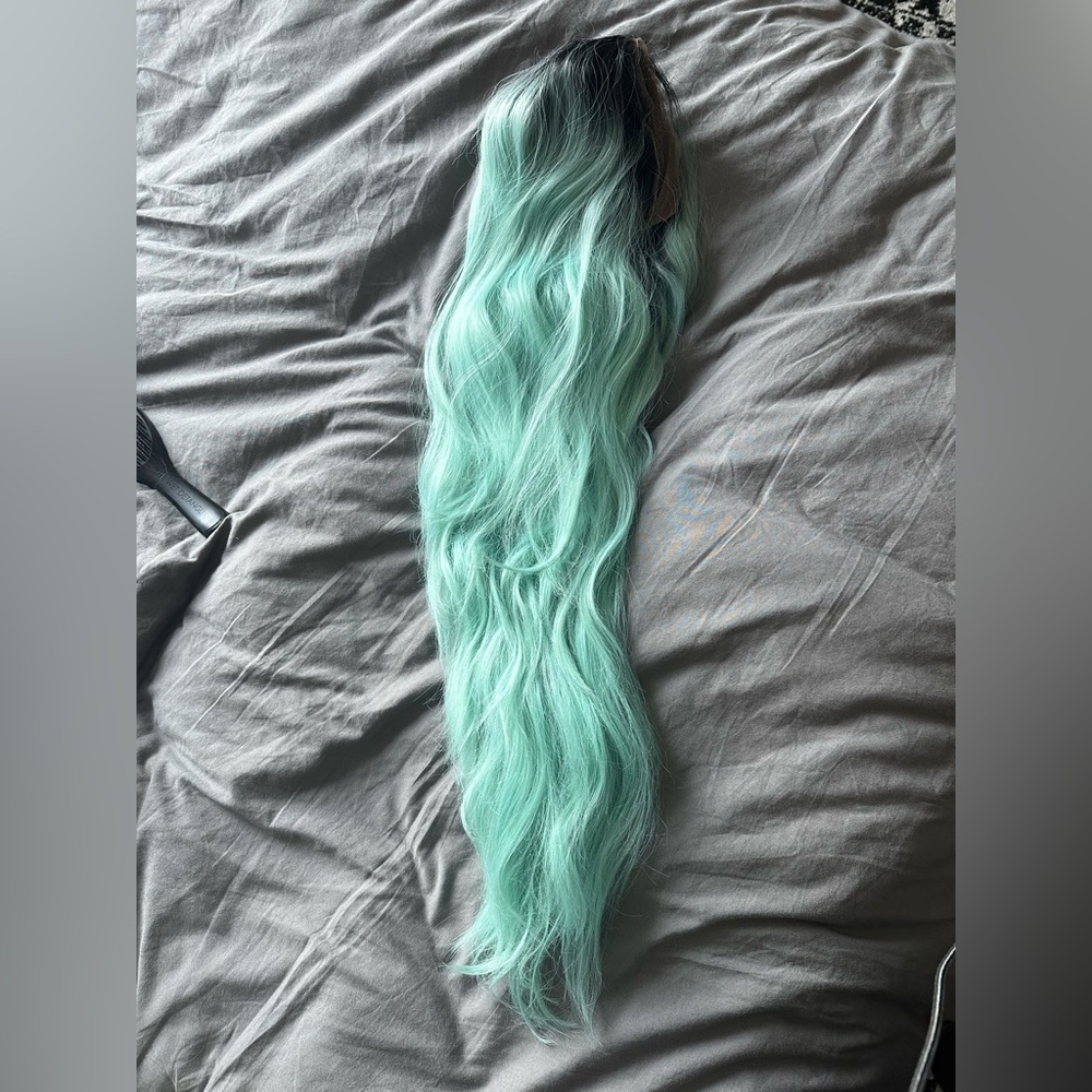 26 inch rooted mint synthetic lace front wig. Lace cut but never worn or styled